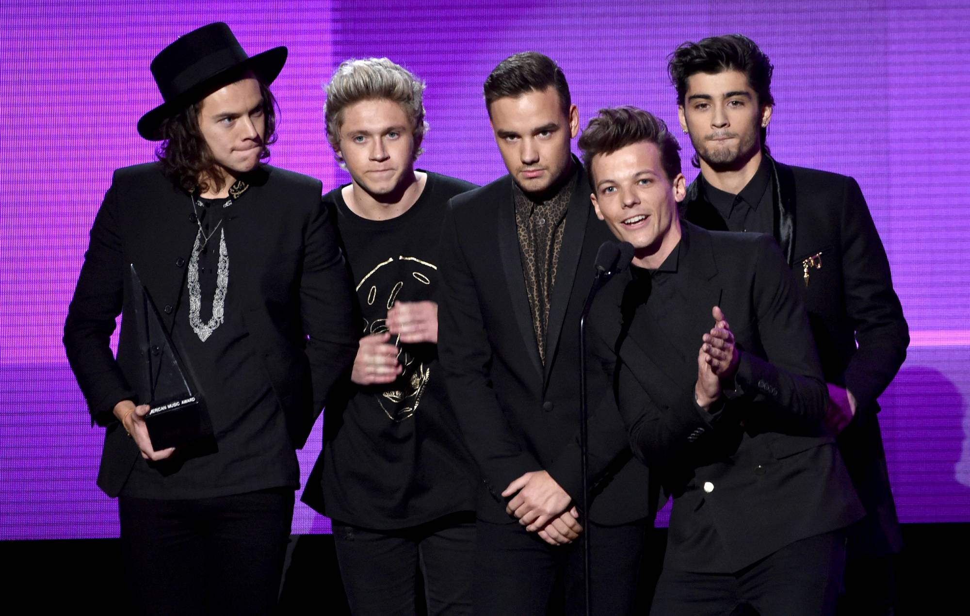 One Direction received the award for Favorite Pop/Rock Band/Duo/Group on stage at the 2014 American Music Awards. (Photo by Kevin Winter/Getty Images)