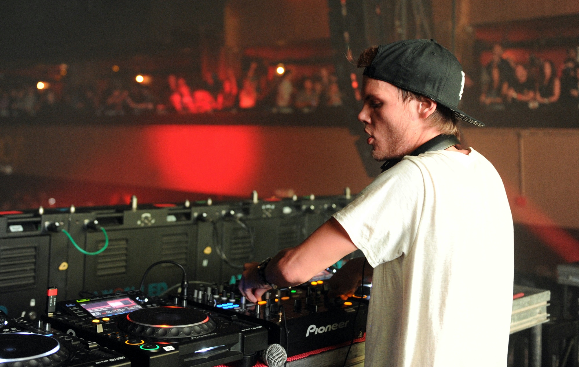 Avicii in the photo DJing