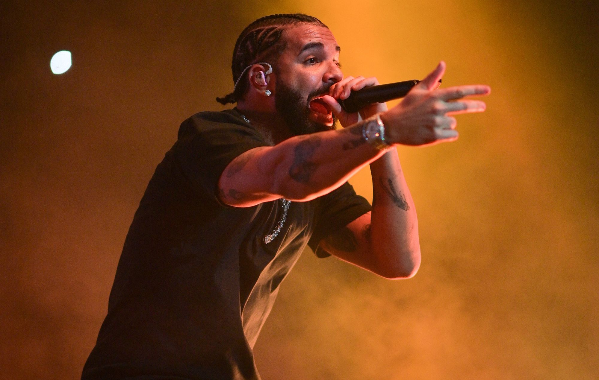 Rapper Drake performs on stage.