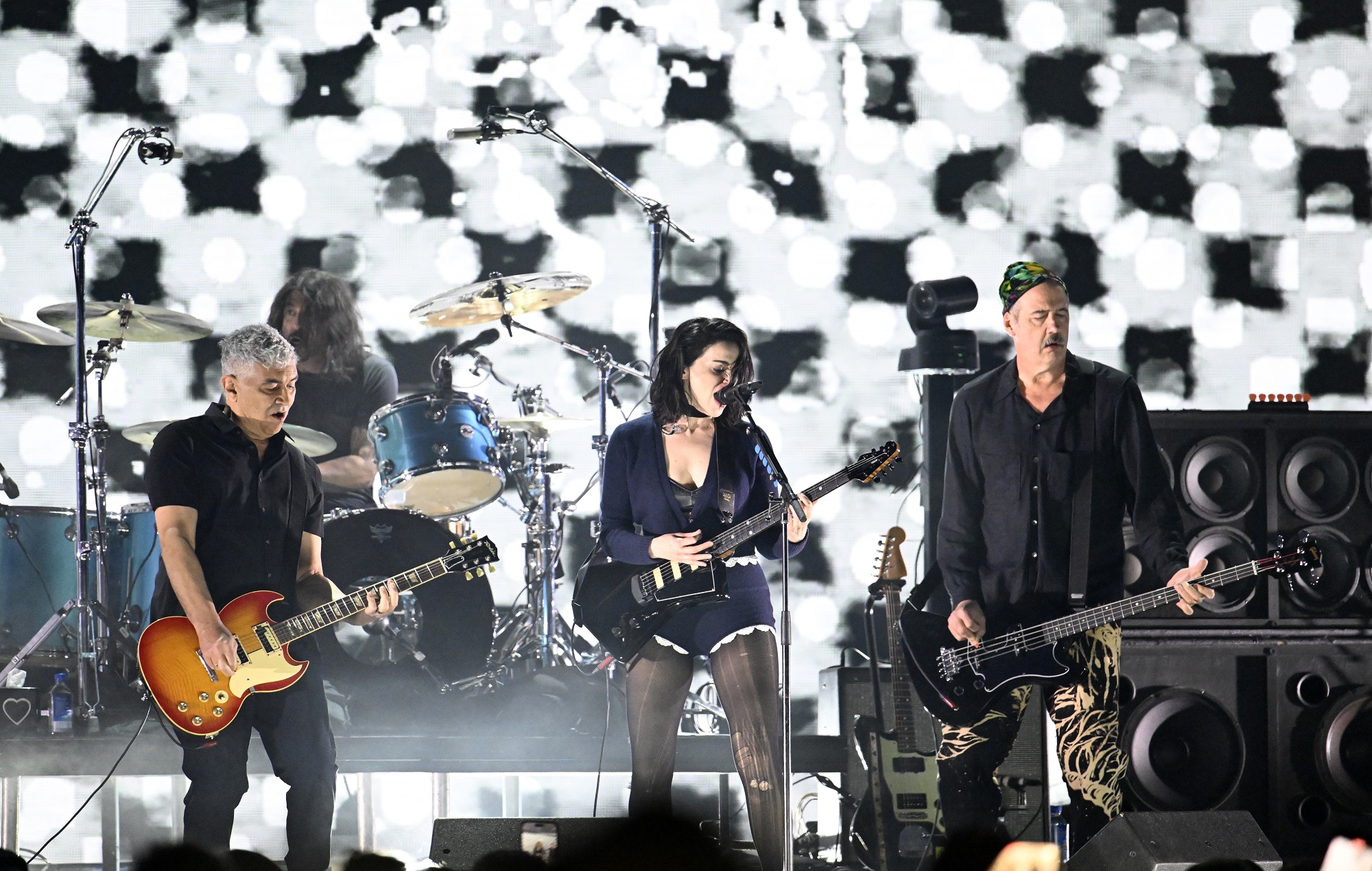 Saint Vincent performs on stage with Pat Smear, Dave Grohl, and Krist Novoselic