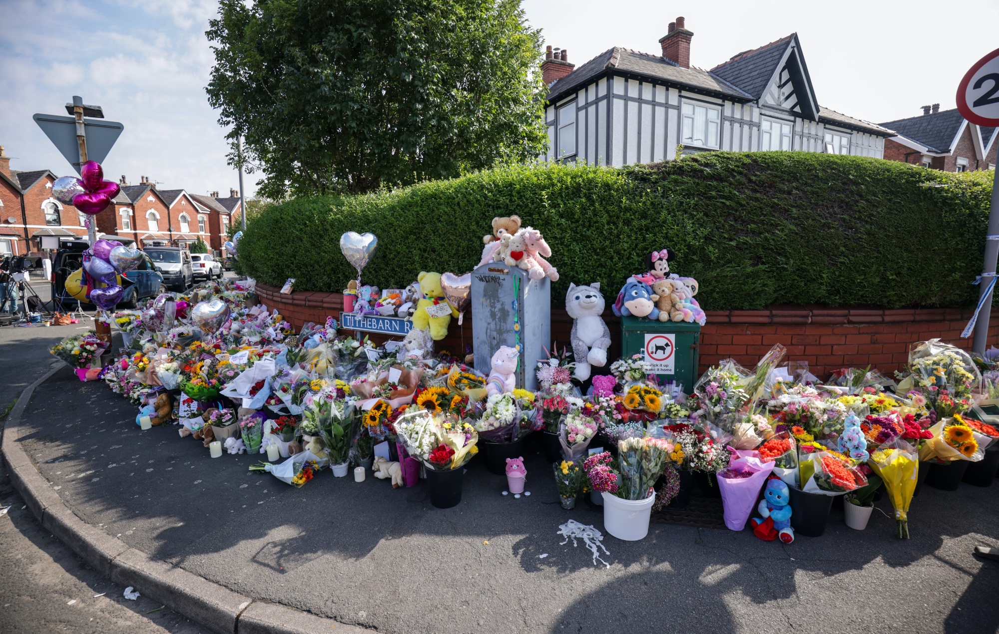 Flower arrangements at the junction of Tithebarn Road and Hart Street in Southport, near where three children were fatally shot at the Taylor Swift-themed party club on Monday, July 29.