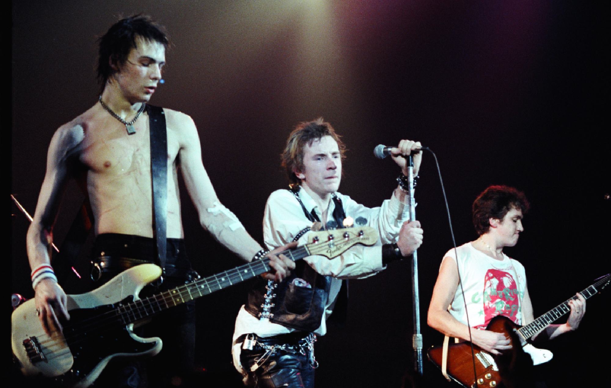 Sid Vicious, Johnny Rotten, and Steve Jones from the Sex Pistols performing in 1978 at Winterland Ballroom in San Francisco, California