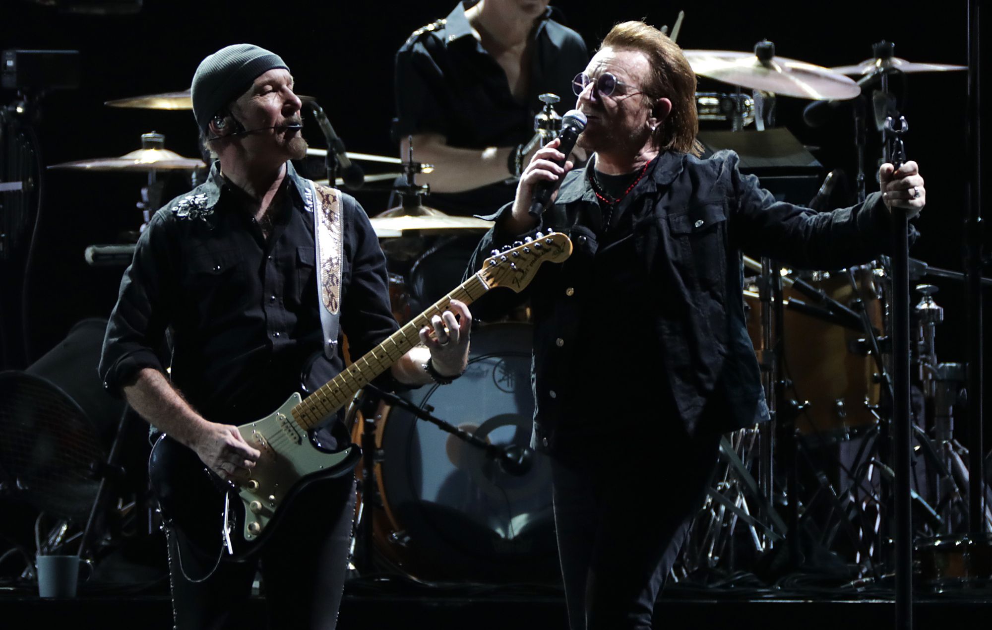 The Edge and Bono from U2 perform on stage