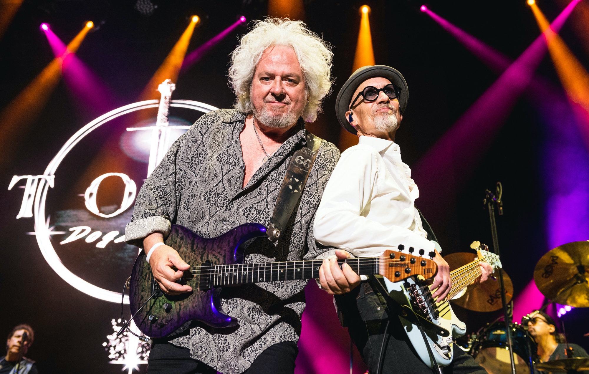 Steve Lukather and John Pierce perform live on stage with Toto