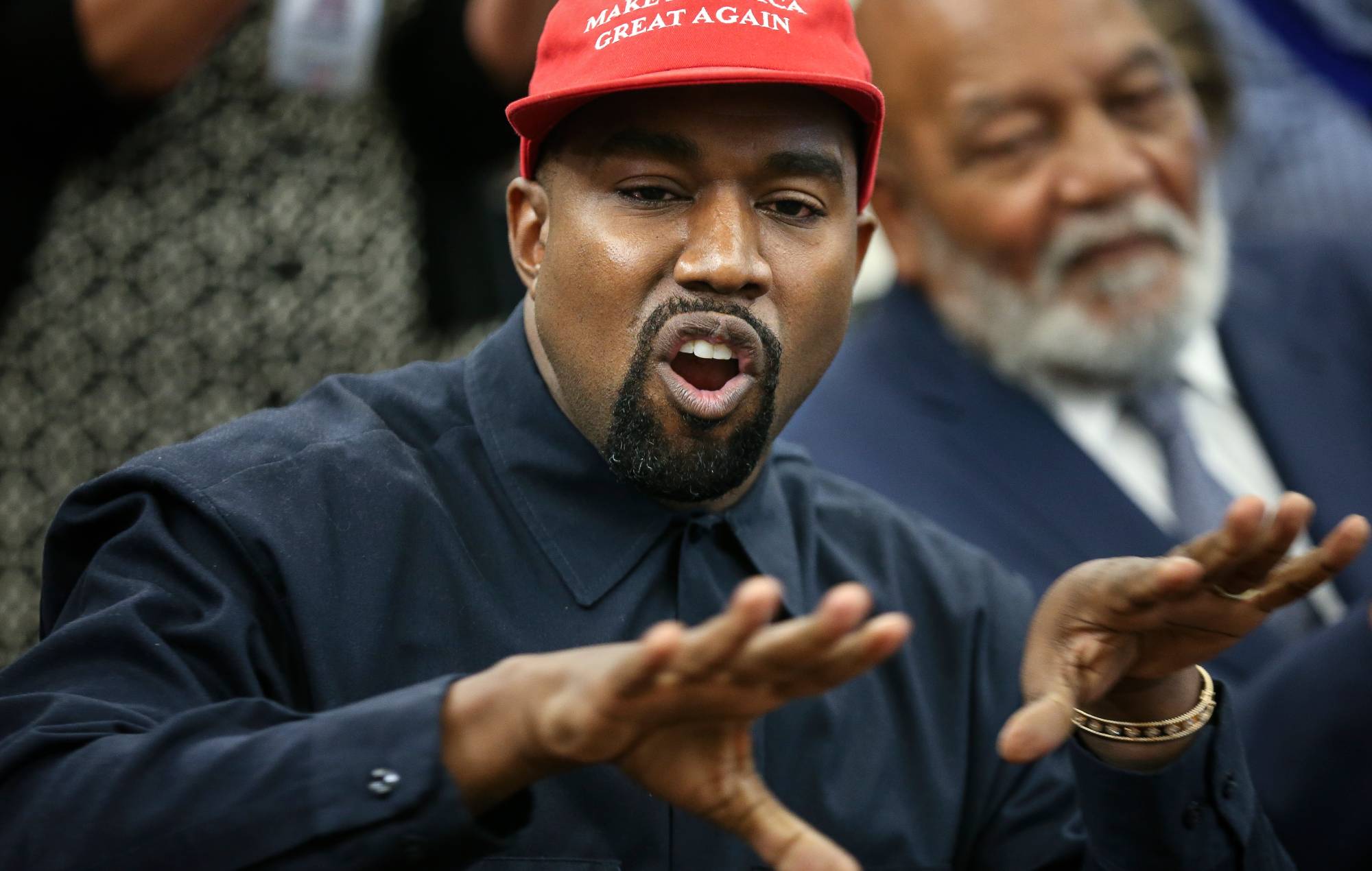 Kanye West acts during a meeting with US President Donald Trump in the White House October 11, 2018 in Washington, the District of Colombia. (Photo of Oliver Contreras - Pool/Getty images)