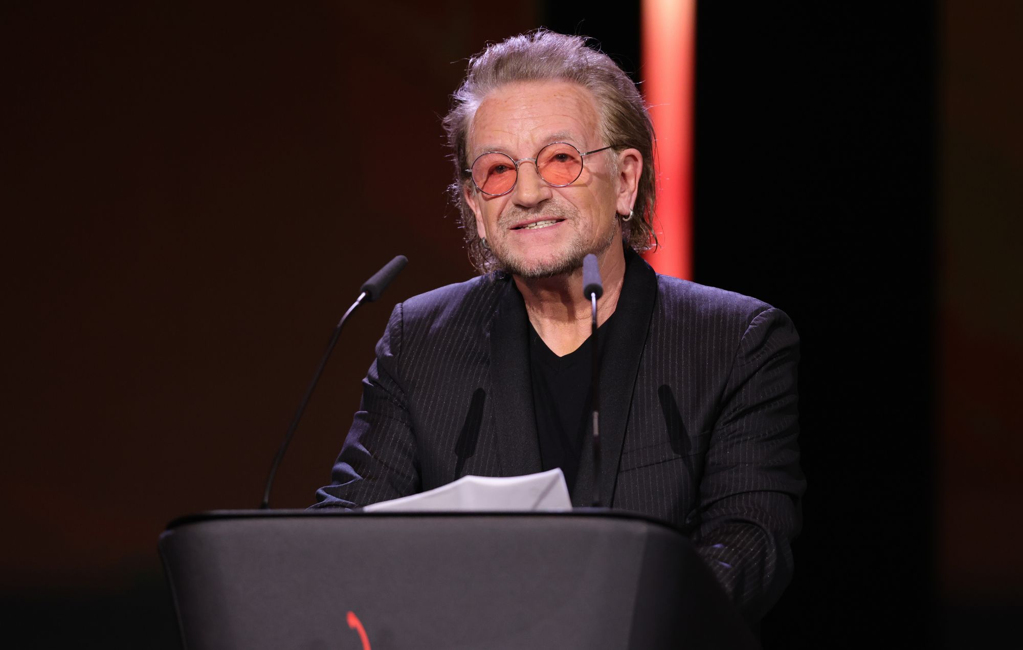 U2 Singer and Frontman Bono speak on stage