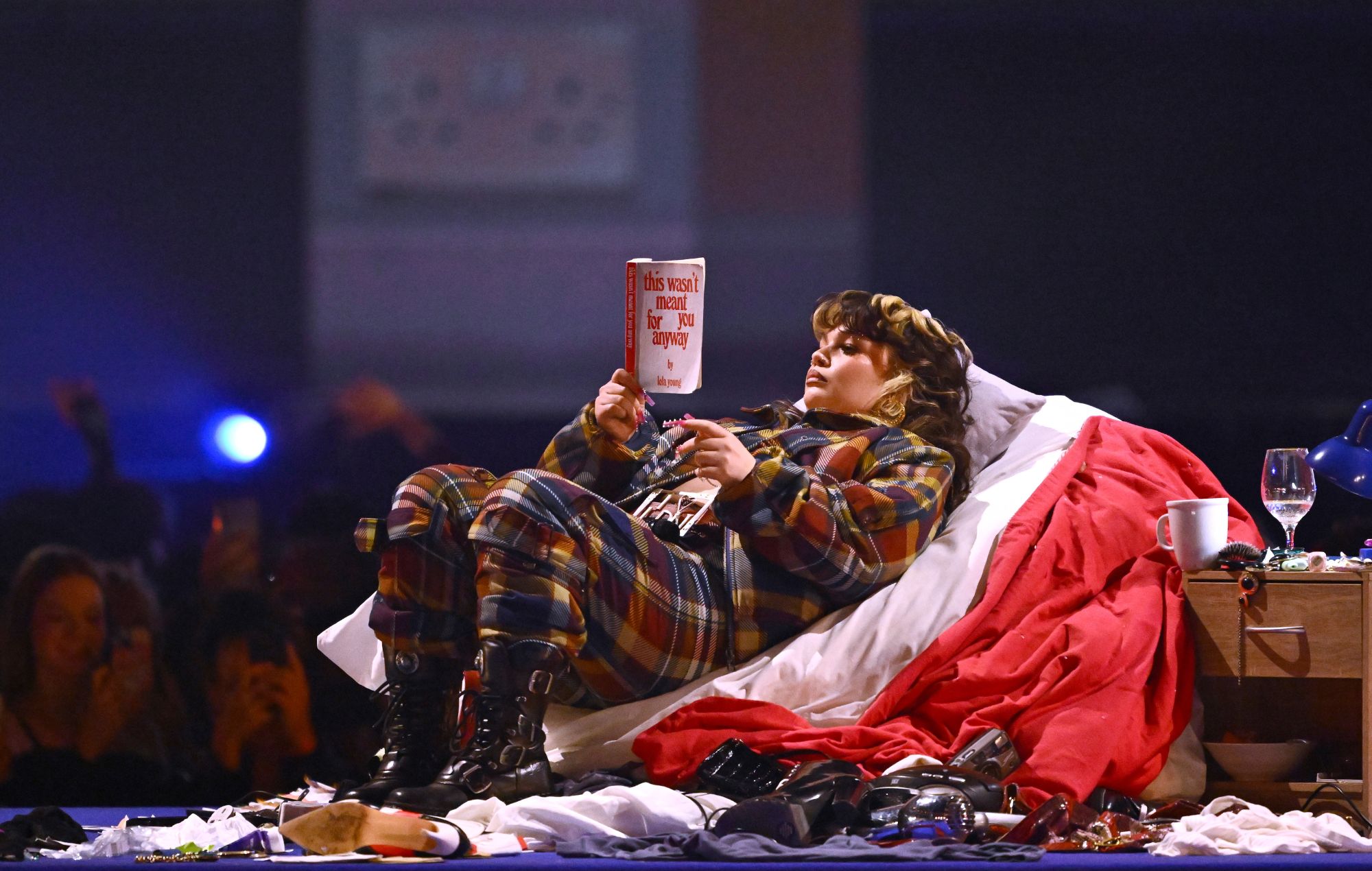 Lola Young performs on stage during the Brit Awards 2025 award