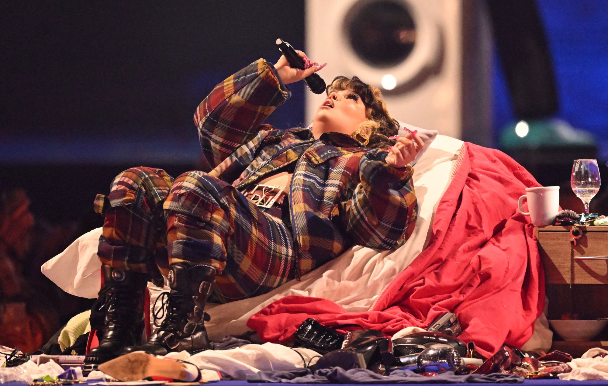 Lola Young performs on stage during the Brit Awards 2025 award