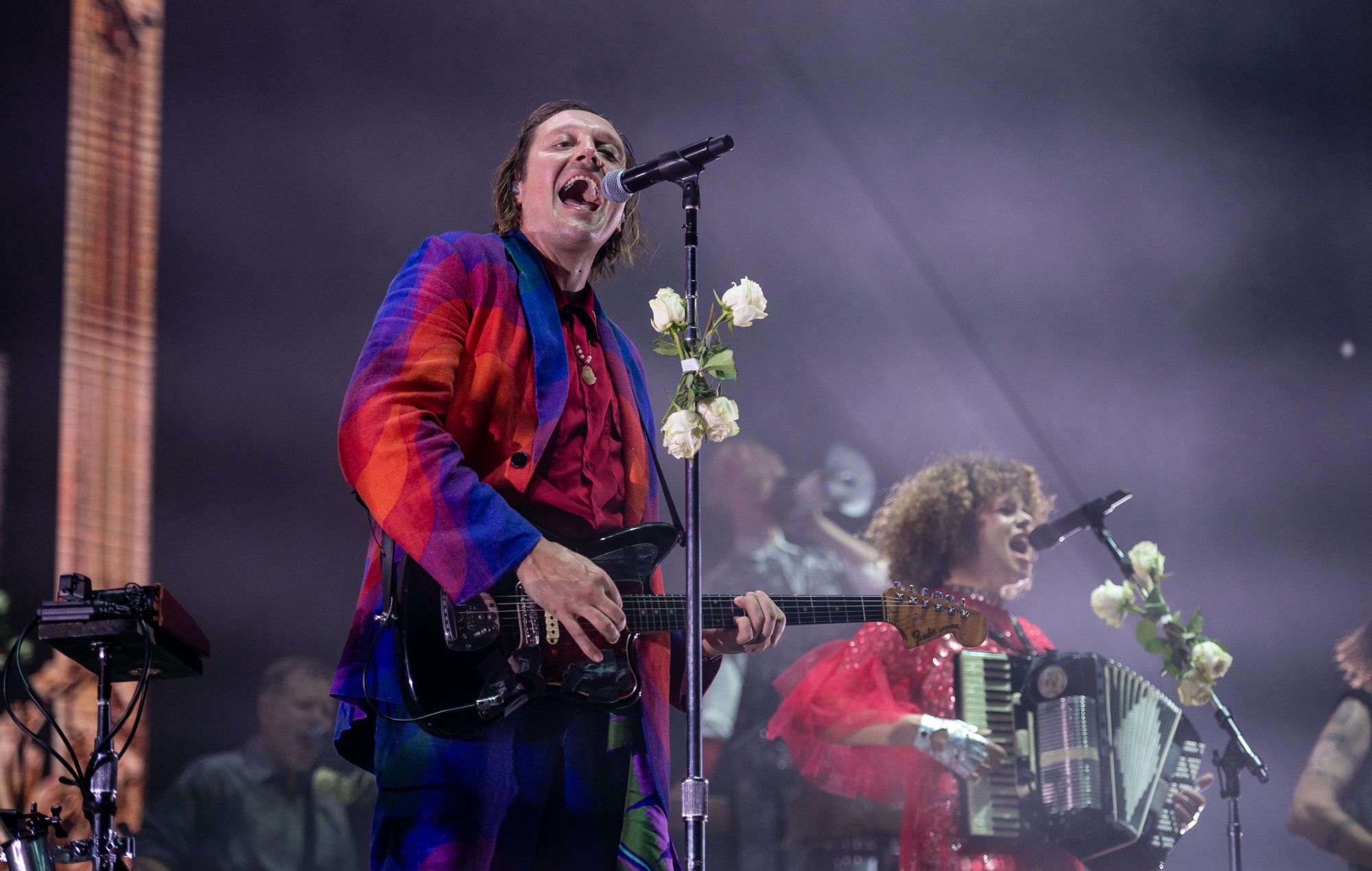 Arcade Fire acts live on stage